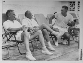 General Duong Van Minh (right) with Walt Rostow and Maxwell Taylor. The men are taking a break from playing tennis during one of Kennedy's "fact finding missions."